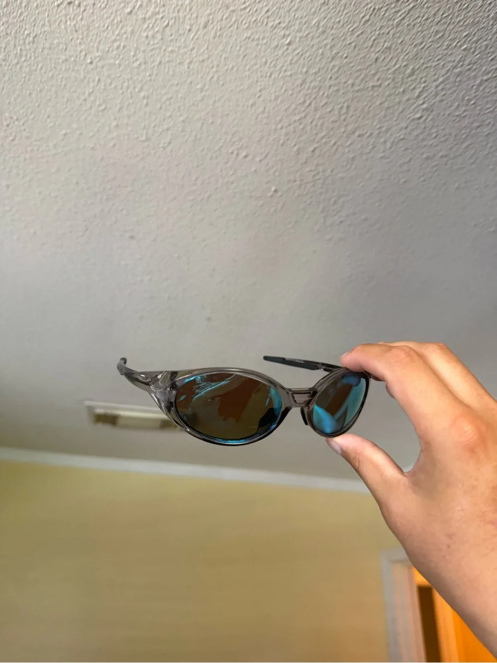 Blue Mirrored Oval Sunglasses Oakley